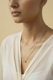 Gold layered necklace with blue zirconia pendant