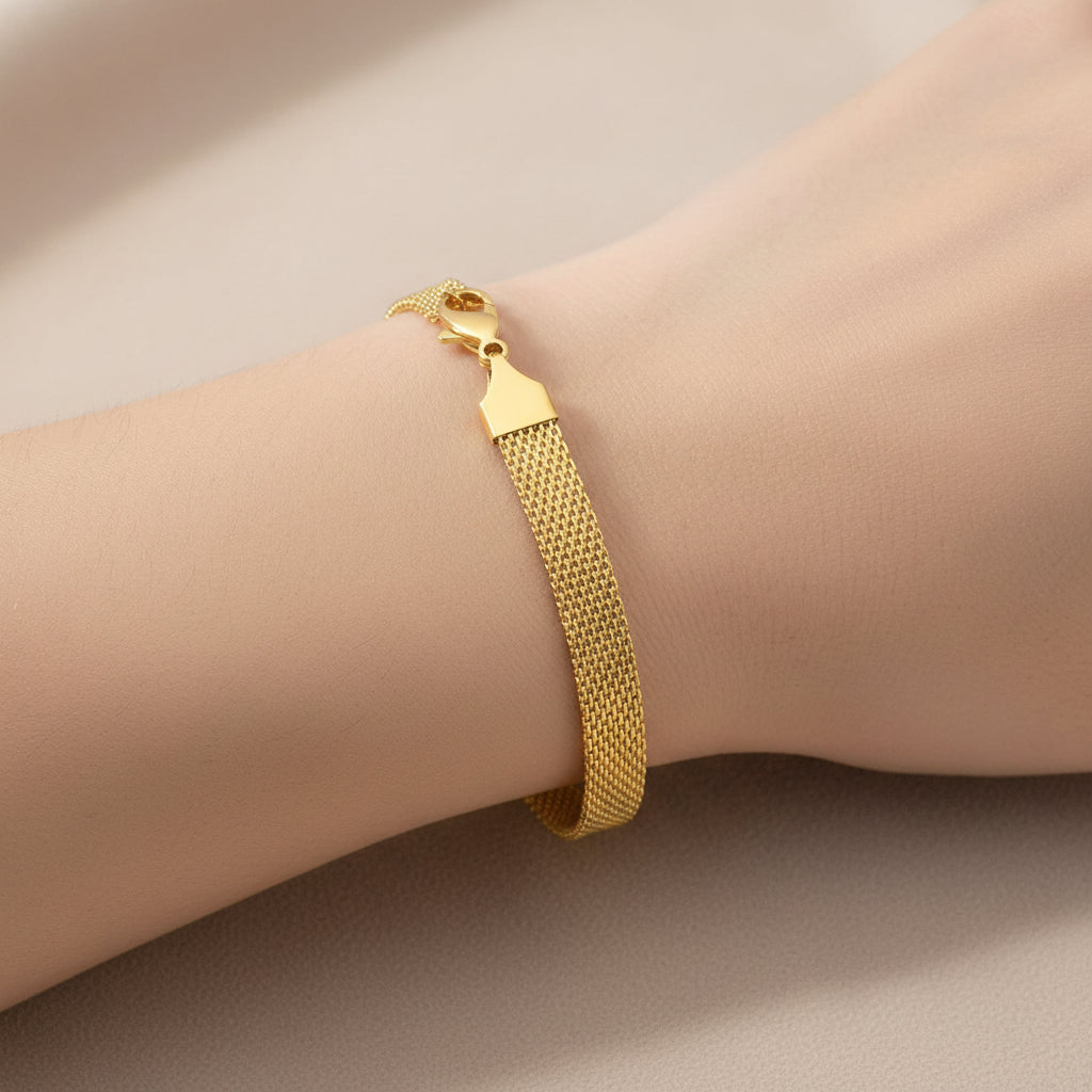 18K gold plated stainless steel bracelet on neutral background