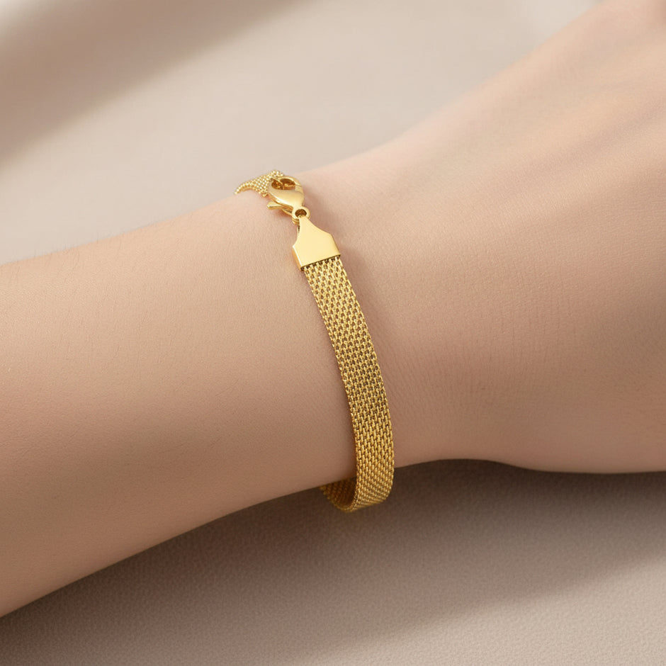 18K gold plated stainless steel bracelet on neutral background