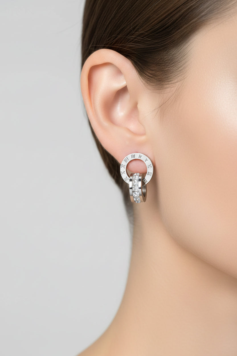 Stainless steel earrings on white background