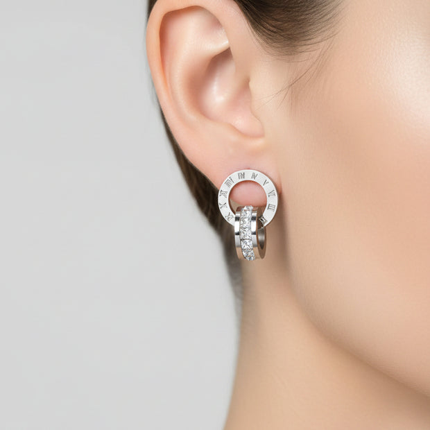 Stainless steel earrings on white background