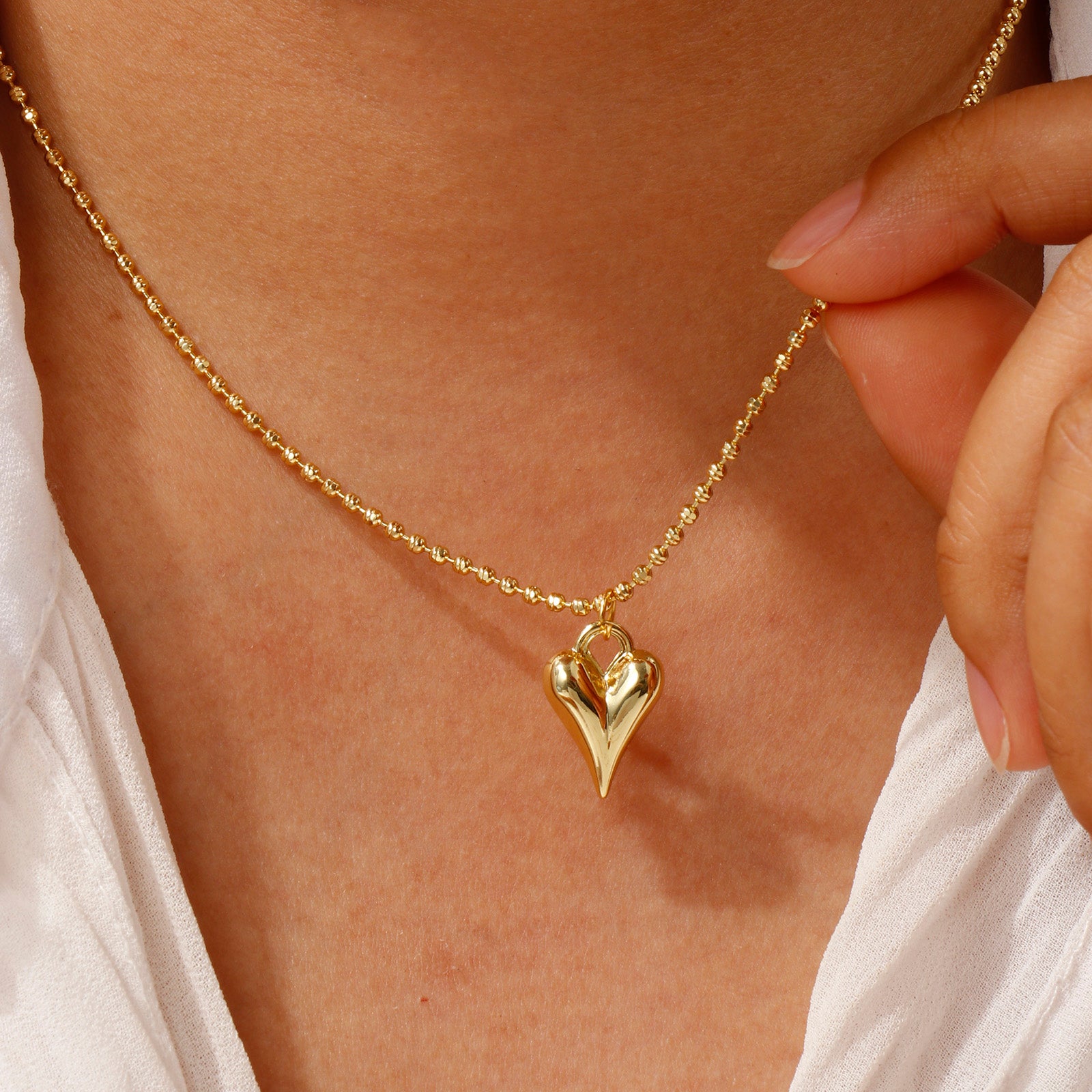 Romantic heart necklace and matching earrings set in gold plated stainless steel. Perfect for gifting.