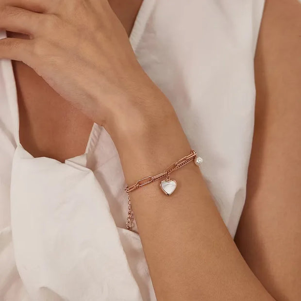 Gold layered bracelet with heart and faux pearl charm