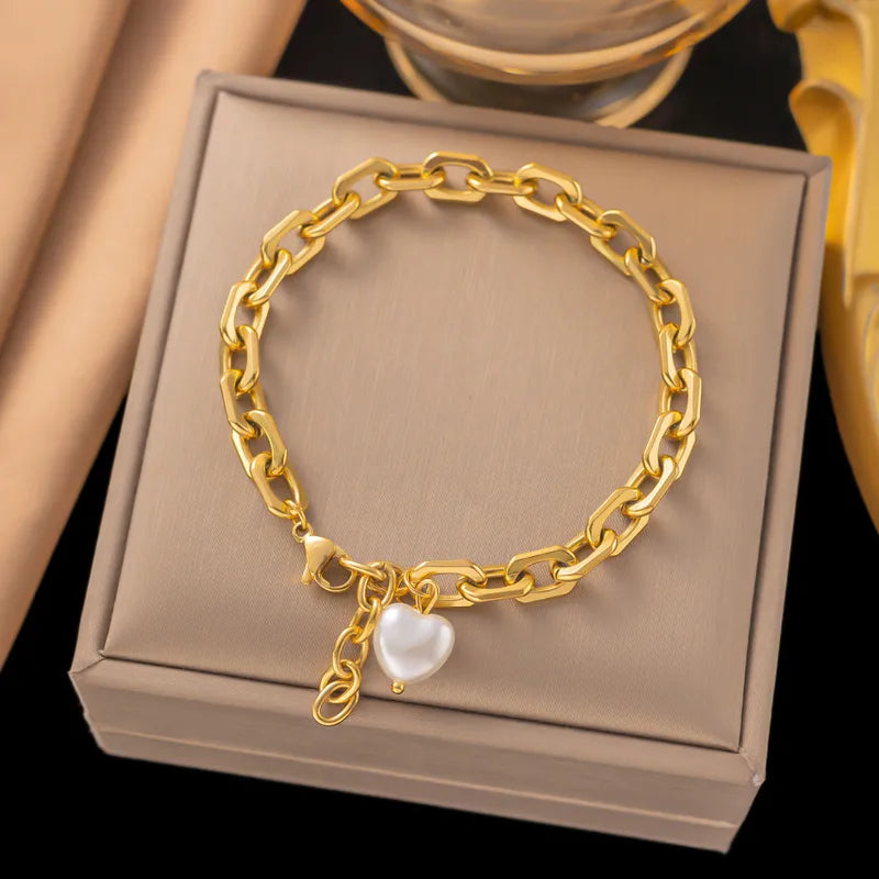 Chunky chain bracelet with pearl heart charm